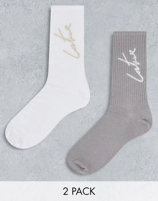 https://images.styletyx.com/images/2-pack-sports-socks-in-white-and-taupe-the-couture-club-13063172_1.webp
