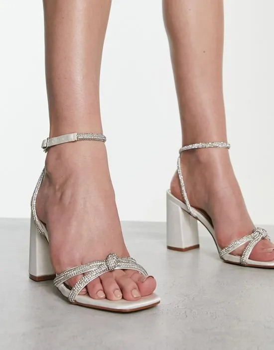 https://images.styletyx.com/images/abina-embellished-sandals-in-ivory-satin-be-mine-13314130_1.webp