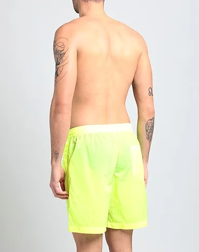 https://images.styletyx.com/images/acid-green-techno-fabric-swim-shorts-msgm-1516498_3.webp