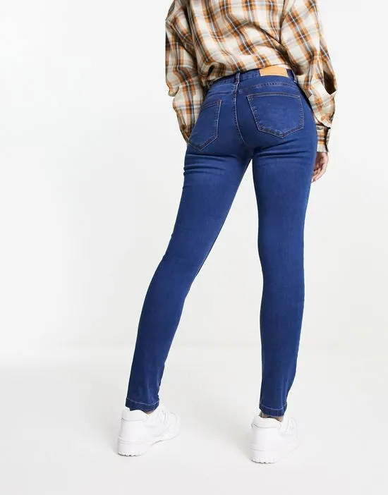 https://images.styletyx.com/images/allie-low-rise-skinny-jeans-in-medium-blue-noisy-may-13086810_2.webp