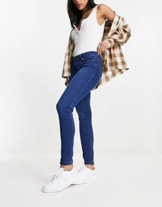 https://images.styletyx.com/images/allie-low-rise-skinny-jeans-in-medium-blue-noisy-may-13086810_5.webp
