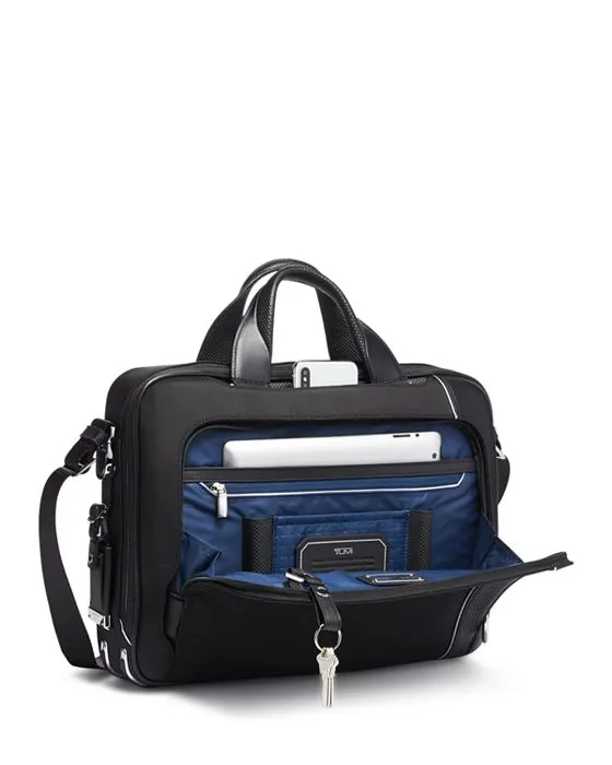 https://images.styletyx.com/images/arrive-sadler-briefcase-tumi-2277402_3.webp