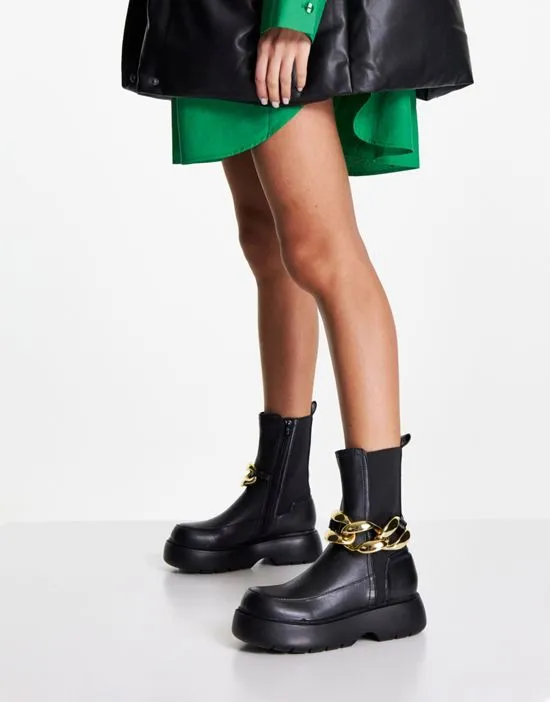 https://images.styletyx.com/images/artist-chelsea-boots-with-chain-in-black-asos-design-2789657_1.webp