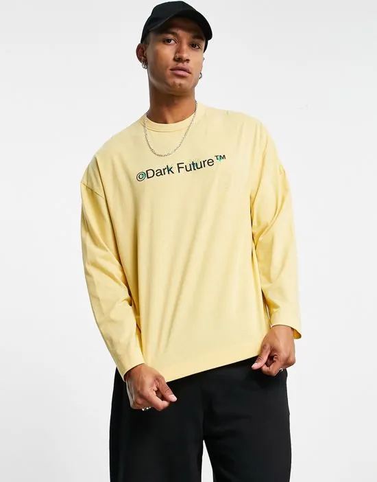 https://images.styletyx.com/images/asos-dark-future-oversized-long-sleeve-t-shirt-with-large-back-graphic-and-logo-print-in-yellow-asos-design-1852451_3.webp