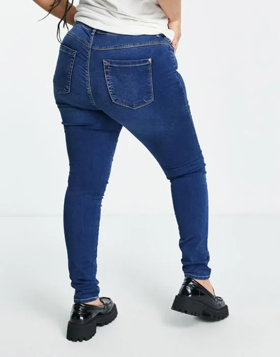 https://images.styletyx.com/images/augusta-high-waisted-skinny-jeans-in-mid-blue-wash-only-curve-2489983_4.webp