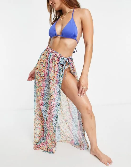 https://images.styletyx.com/images/beach-maxi-sarong-in-rainbow-ditsy-print-kulani-kinis-1974521_2.webp