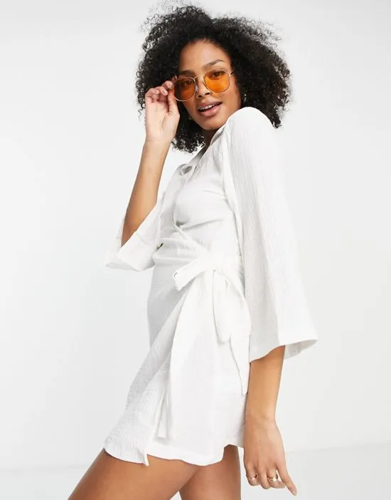 https://images.styletyx.com/images/beach-wrap-dress-in-white-urban-threads-13314225_1.webp