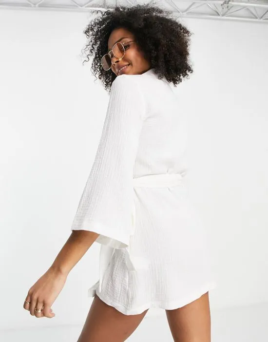 https://images.styletyx.com/images/beach-wrap-dress-in-white-urban-threads-13314225_3.webp