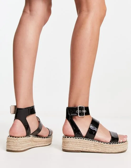 https://images.styletyx.com/images/bebo-bellini-three-part-espadrille-flatforms-in-black-patent-bebo-626950752_2.webp