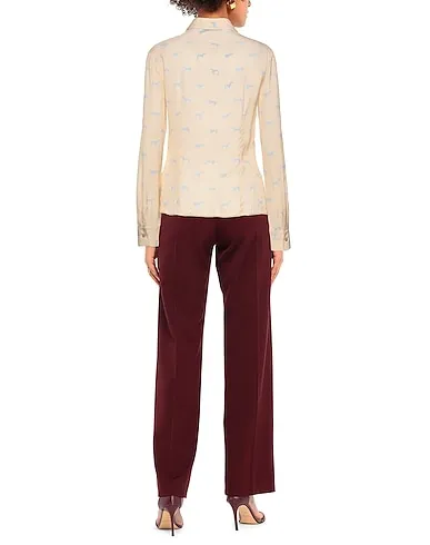 https://images.styletyx.com/images/beige-crepe-patterned-shirts-blouses-trussardi-1395217_3.webp