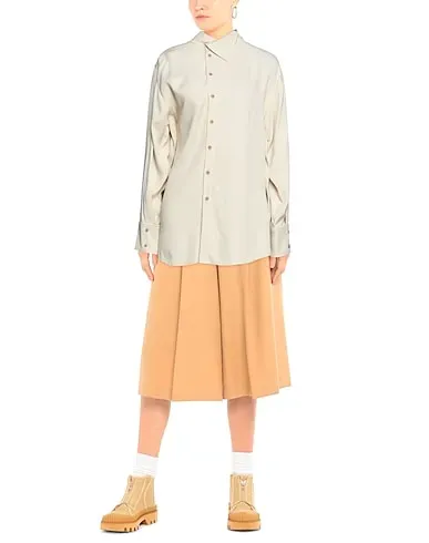 https://images.styletyx.com/images/beige-crepe-solid-color-shirts-blouses-rejina-pyo-1448263_2.webp