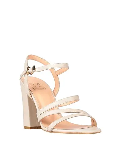 https://images.styletyx.com/images/beige-leather-sandals-nora-new-york-3313915_2.webp
