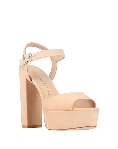 https://images.styletyx.com/images/beige-sandals-stuart-weitzman-2924209_2.webp