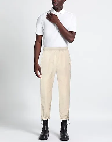 https://images.styletyx.com/images/beige-techno-fabric-casual-pants-arnar-mar-jonsson-13137772_2.webp