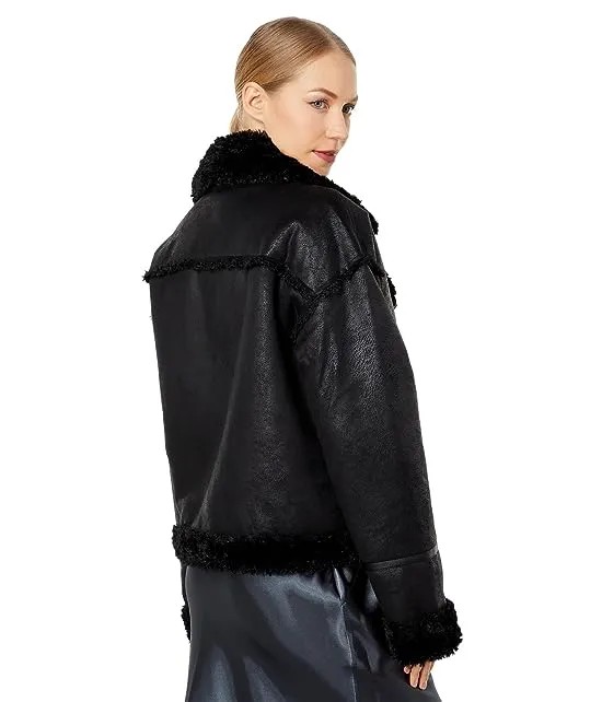 https://images.styletyx.com/images/berber-faux-down-cropped-puffer-jacket-nvlt-3039945_2.webp