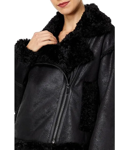 https://images.styletyx.com/images/berber-faux-down-cropped-puffer-jacket-nvlt-3039945_3.webp