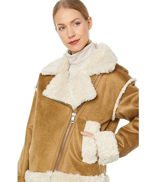 https://images.styletyx.com/images/berber-faux-down-cropped-puffer-jacket-nvlt-3039946_3.webp