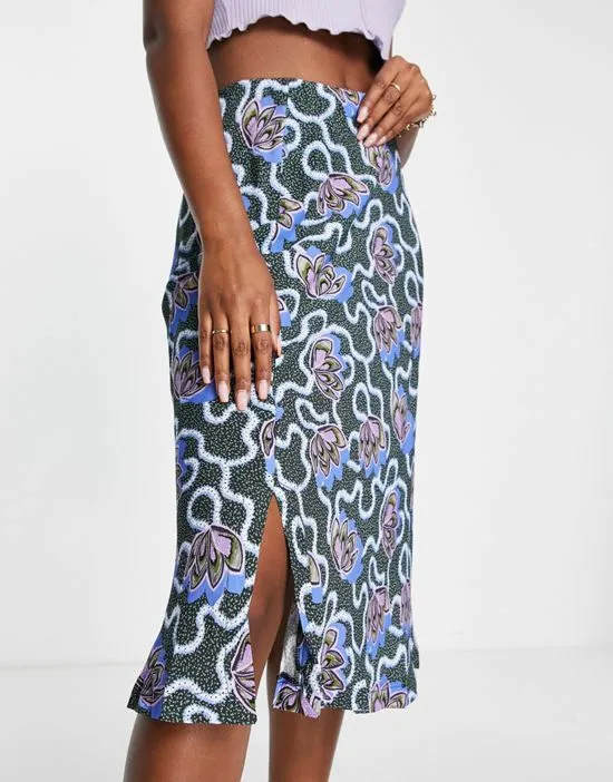 https://images.styletyx.com/images/bias-cut-midi-skirt-in-dark-green-print-closet-london-12911675_3.webp