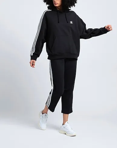 https://images.styletyx.com/images/black-casual-pants-originals-adicolor-open-hem-pants-adidas-13124813_2.webp