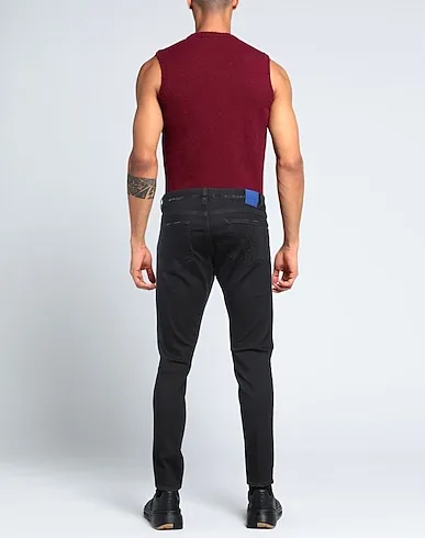 https://images.styletyx.com/images/black-denim-denim-pants-marcelo-burlon-243497933_3.webp