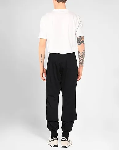 https://images.styletyx.com/images/black-jersey-casual-pants-424-fourtwofour-3060952_3.webp
