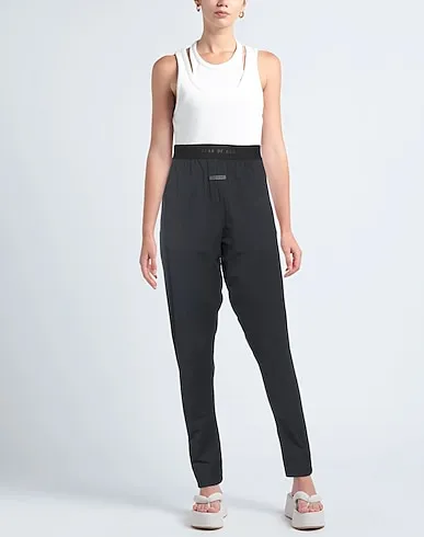 https://images.styletyx.com/images/black-jersey-casual-pants-fear-of-god-13371867_2.webp