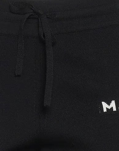 https://images.styletyx.com/images/black-jersey-casual-pants-marc-jacobs-13415149_4.webp