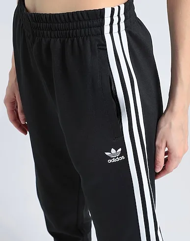 https://images.styletyx.com/images/black-jersey-casual-pants-sst-classic-tp-adidas-1274553920_4.webp