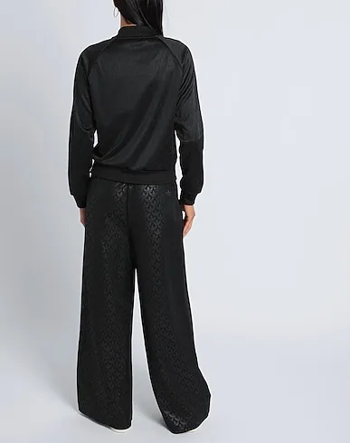 https://images.styletyx.com/images/black-jersey-casual-pants-trackpant-aop-adidas-909703416_3.webp