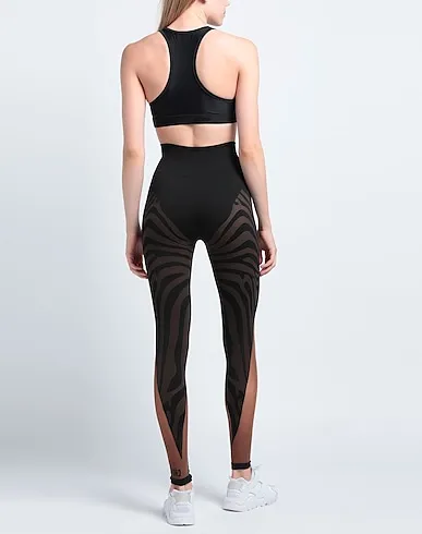 https://images.styletyx.com/images/black-jersey-leggings-gcds-1223640203_3.webp