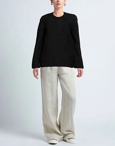 https://images.styletyx.com/images/black-knitted-sweater-comme-des-garcons-874130744_2.webp