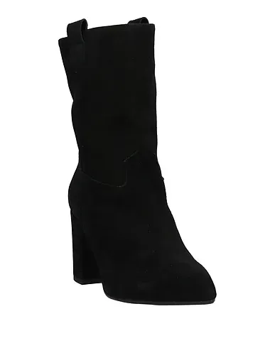 https://images.styletyx.com/images/black-leather-ankle-boot-tiqu-13407810_2.webp