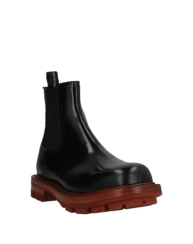 https://images.styletyx.com/images/black-leather-boots-alexander-mcqueen-3454807_2.webp