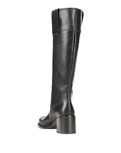https://images.styletyx.com/images/black-leather-boots-miu-miu-243274646_3.webp
