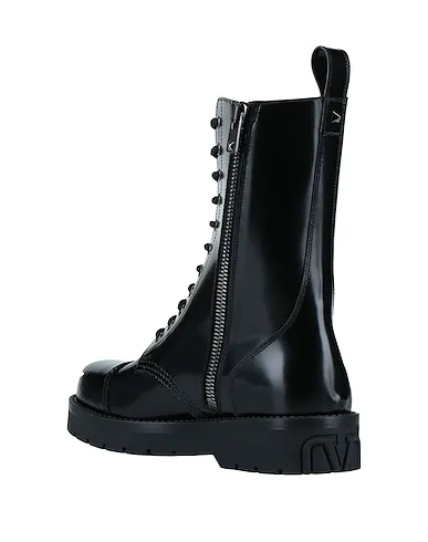 https://images.styletyx.com/images/black-leather-boots-valentino-13221273_3.webp