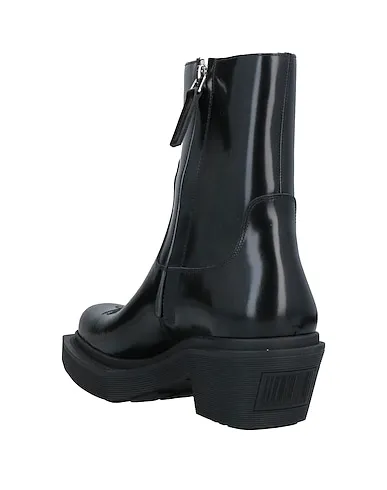 https://images.styletyx.com/images/black-leather-boots-vetements-1007406889_3.webp