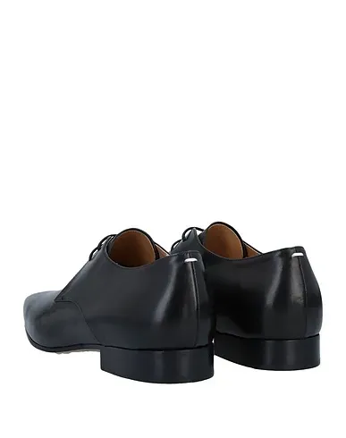 https://images.styletyx.com/images/black-leather-laced-shoes-maison-margiela-1365119_3.webp