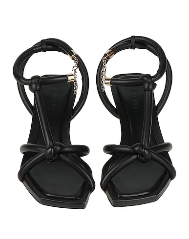 https://images.styletyx.com/images/black-leather-sandals-jimmy-choo-13419345_4.webp