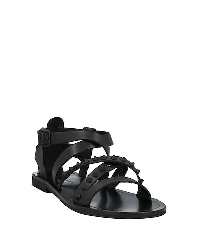 https://images.styletyx.com/images/black-leather-sandals-mich-e-simon-13148531_2.webp