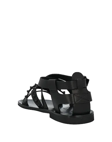 https://images.styletyx.com/images/black-leather-sandals-mich-e-simon-13148531_3.webp