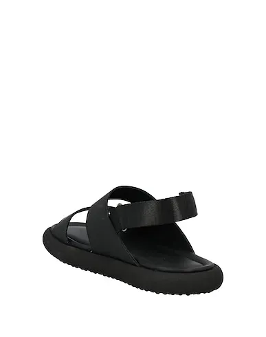 https://images.styletyx.com/images/black-leather-sandals-mich-e-simon-13161125_3.webp