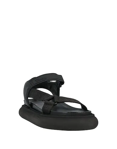 https://images.styletyx.com/images/black-leather-sandals-moncler-2866394_2.webp