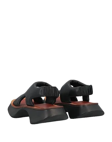 https://images.styletyx.com/images/black-leather-sandals-proenza-schouler-3360610_3.webp