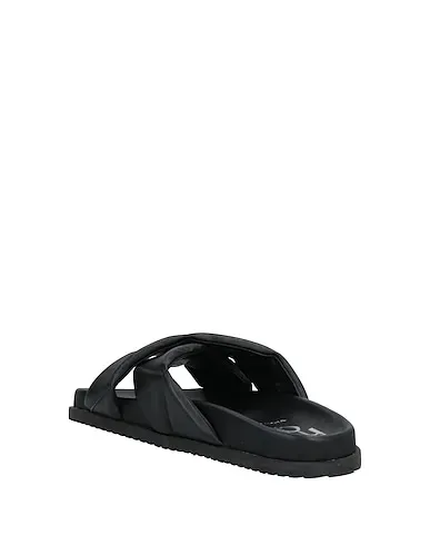 https://images.styletyx.com/images/black-leather-sandals-studio-mode-13302579_3.webp