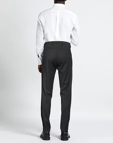 https://images.styletyx.com/images/black-plain-weave-casual-pants-luca-bertelli-1009887967_3.webp