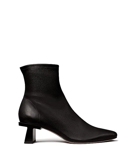 https://images.styletyx.com/images/block-t-heel-ankle-boot-55-mm-tory-burch-2888072_2.webp
