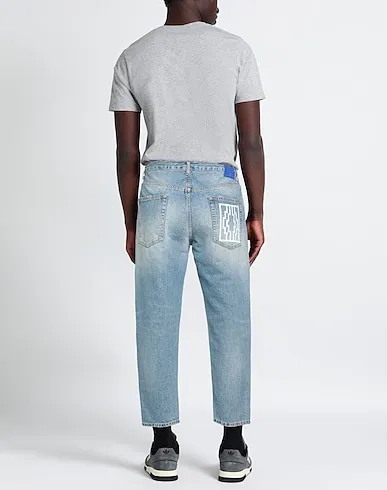 https://images.styletyx.com/images/blue-denim-denim-pants-marcelo-burlon-13263524_3.webp