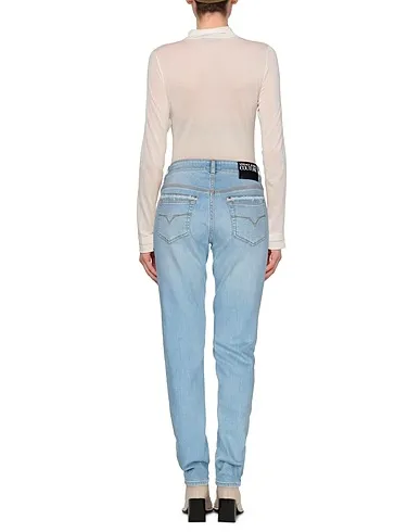 https://images.styletyx.com/images/blue-denim-denim-pants-versace-1701658_3.webp