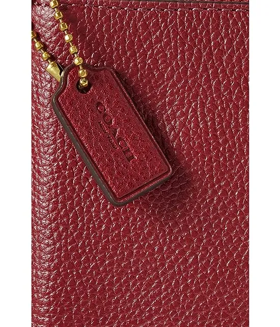 https://images.styletyx.com/images/box-program-polished-pebble-small-wristlet-coach-13167637_4.webp