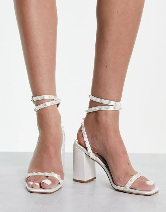 https://images.styletyx.com/images/bridal-naava-block-heel-sandals-with-pearl-embellishment-in-ivory-be-mine-13291799_4.webp
